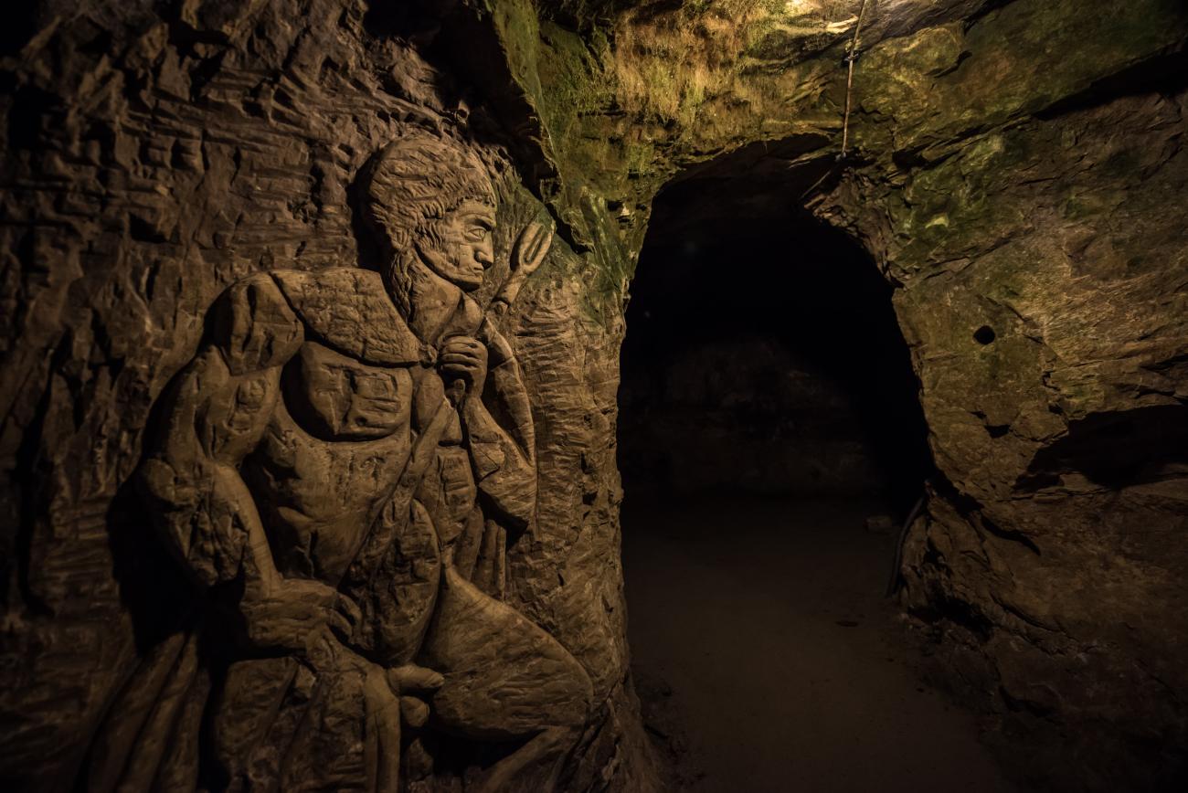 Engraving of Orpheus into a cave wall with an entrance to the cave. Devil's Throat in Bulgaria